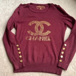 Burgundy long sleeve top with gold accent buttons.  Small.